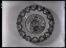 Majolikový talíř se sv. Janem Nep. z r. 1854, práva hrnčíře Fr____ Zavřela (?)