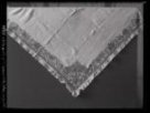 Roh vyšívaného šátku. Zapsán v museu nymburském pod číslem 105 - 2333